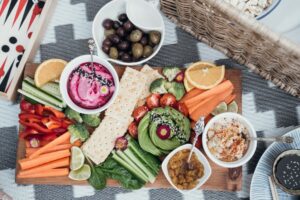 Healthy foods such as fruits, vegetables and dips on a grazing platter