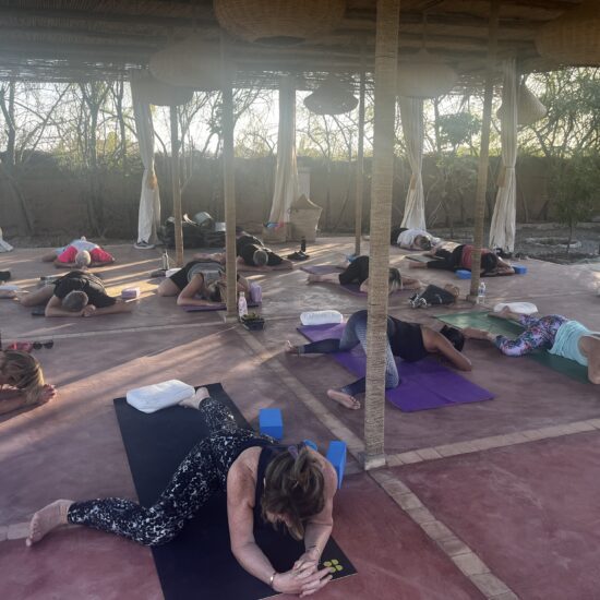 Retreat attendees doing Yoga at Fawakay Villa