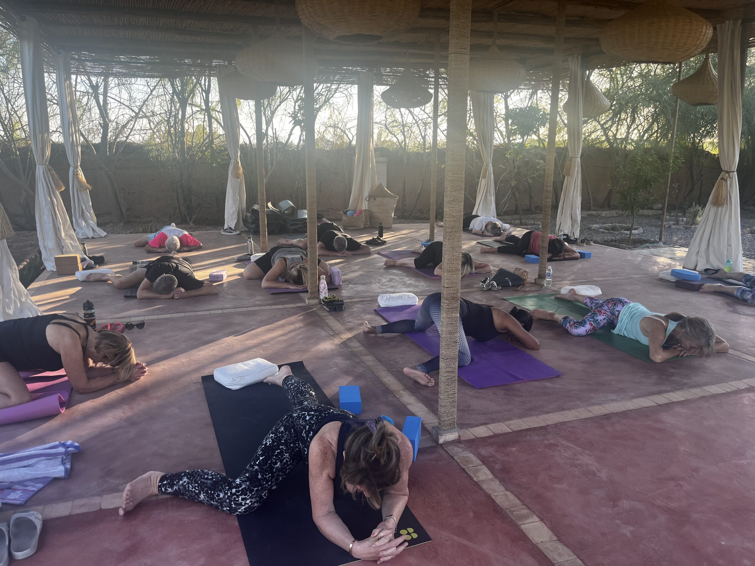 Retreat attendees doing Yoga at Fawakay Villa